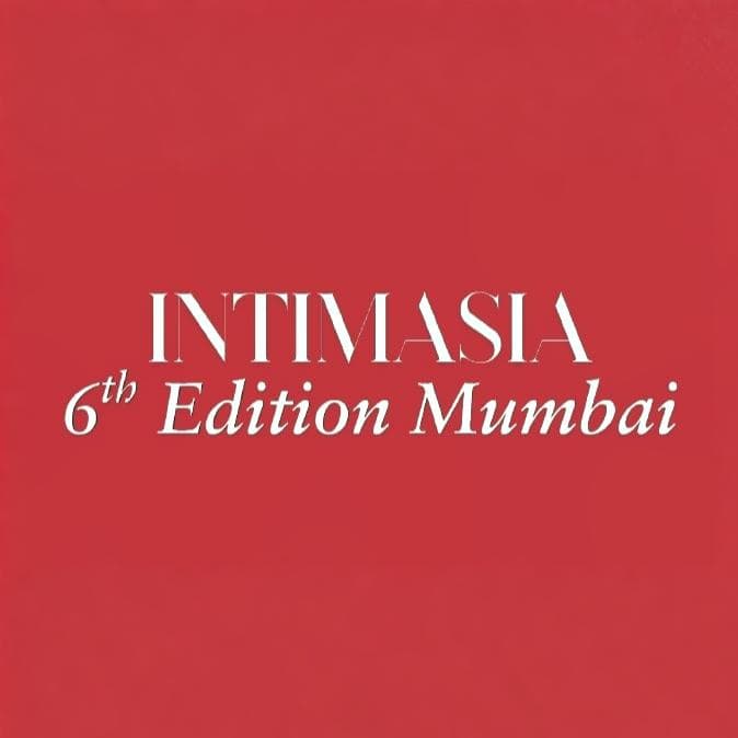 People browsing clothing at exhibition booth