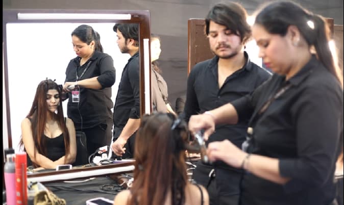 People browsing clothing at exhibition booth