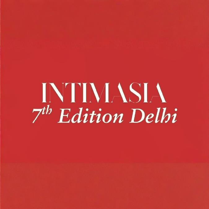 People browsing clothing at exhibition booth